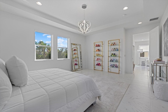 bedroom featuring a notable chandelier