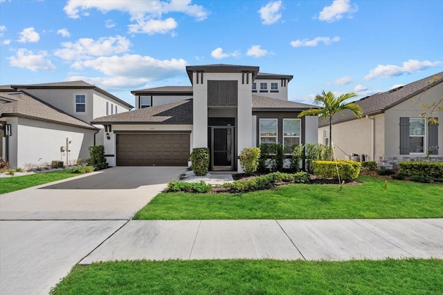 prairie-style house with a garage and a front lawn