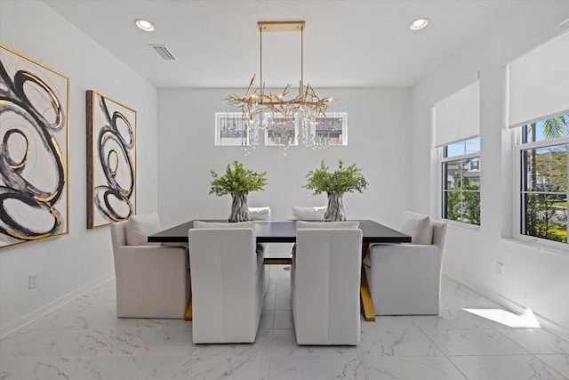 dining space featuring an inviting chandelier