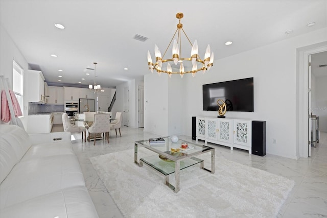 living room featuring an inviting chandelier