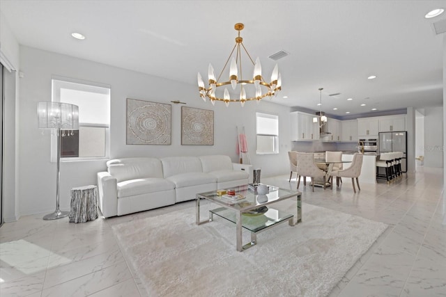 living room featuring an inviting chandelier