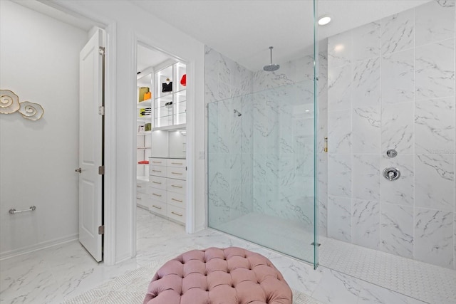 bathroom featuring a tile shower