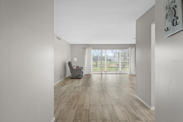 hallway featuring light hardwood / wood-style floors