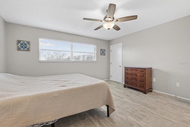 bedroom featuring light hardwood / wood-style flooring and ceiling fan