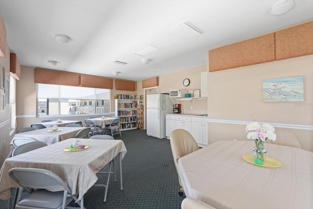 view of carpeted dining area