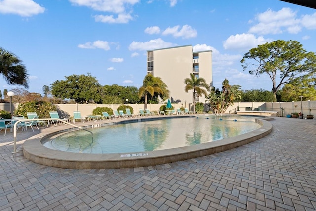 view of swimming pool with a patio