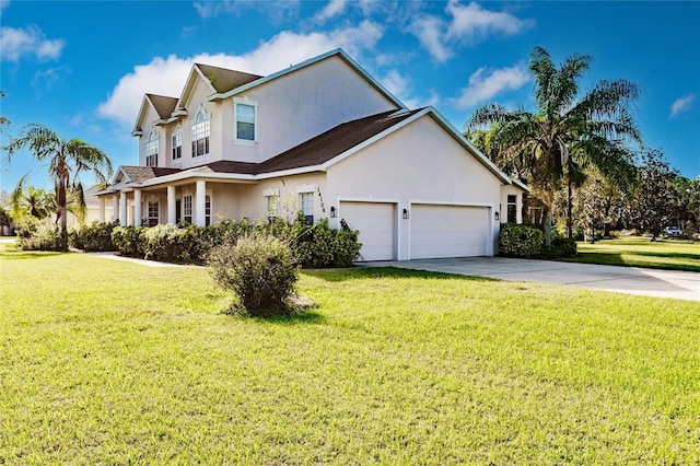 view of front of property featuring a front yard and a garage