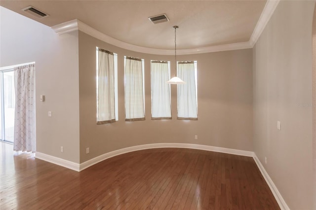 unfurnished room with hardwood / wood-style floors and ornamental molding