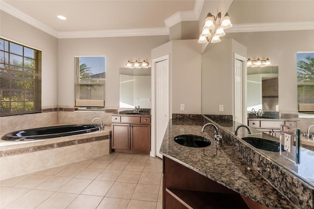 bathroom featuring plenty of natural light, ornamental molding, and vanity