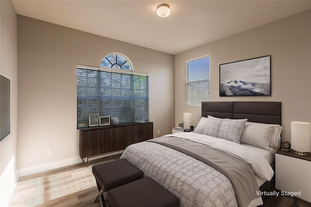 bedroom with light wood-type flooring