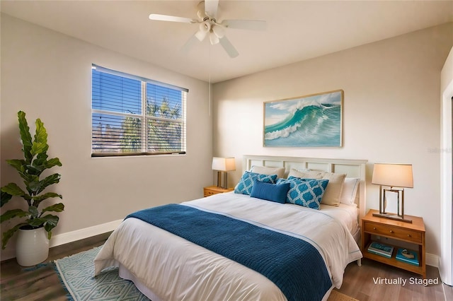 bedroom featuring dark hardwood / wood-style floors and ceiling fan