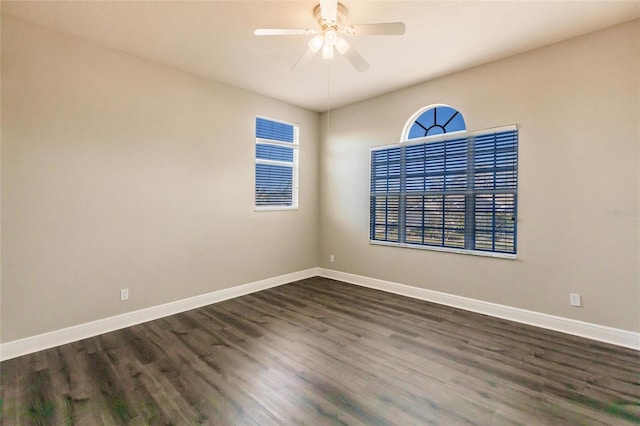 unfurnished room featuring dark hardwood / wood-style flooring and ceiling fan