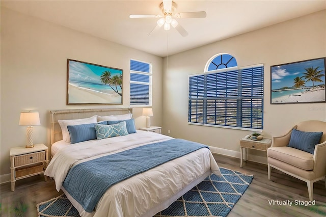 bedroom with ceiling fan and dark hardwood / wood-style flooring