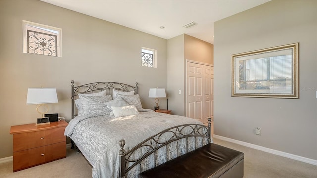 carpeted bedroom featuring a closet