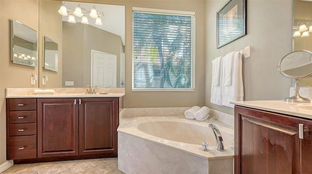 bathroom featuring a washtub, vanity, and tile patterned floors