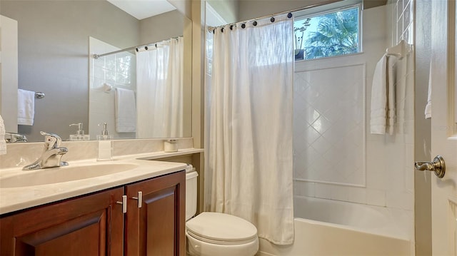 full bathroom with vanity, shower / bath combination with curtain, and toilet