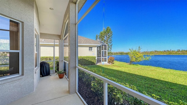 balcony featuring a water view