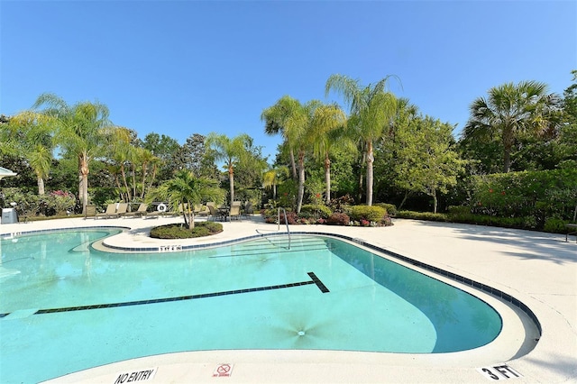 view of swimming pool with a patio area