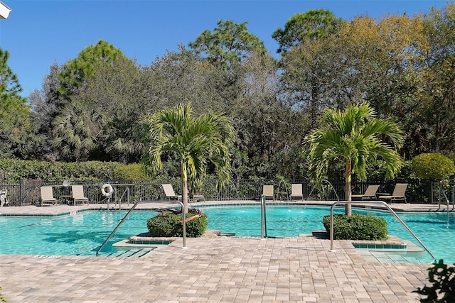 view of swimming pool featuring a patio