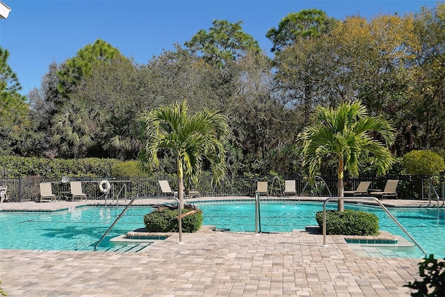 7407 Sea Island Ln, Bradenton, FL 34201 - community pool with a patio and view of scattered trees