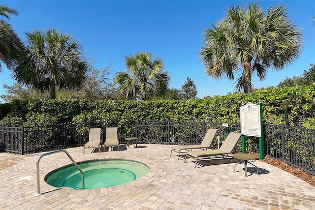 7407 Sea Island Ln, Bradenton, FL 34201 - view of swimming pool featuring a community hot tub and a patio