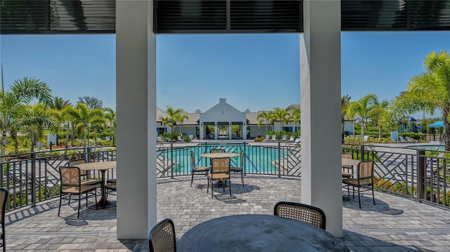 view of patio featuring a community pool