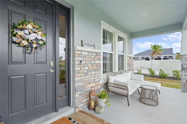 doorway to property with a porch