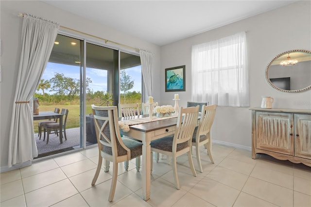 tiled dining space with a healthy amount of sunlight