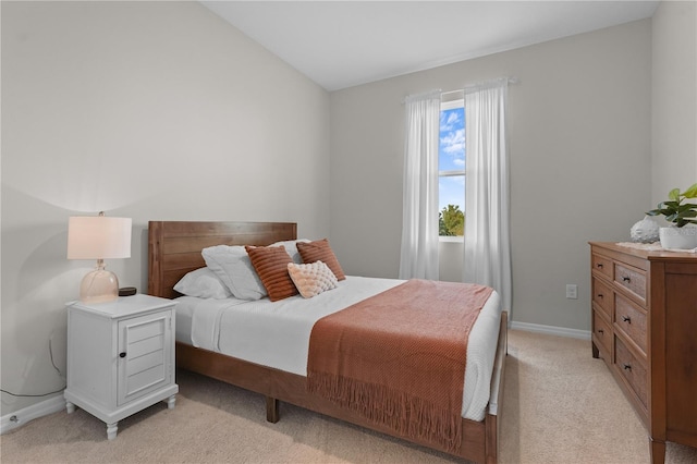 carpeted bedroom featuring vaulted ceiling