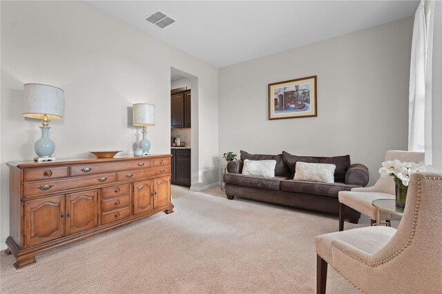 living room with light colored carpet