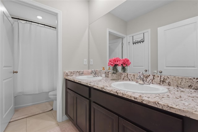 full bathroom featuring tile patterned floors, vanity, toilet, and shower / tub combo with curtain