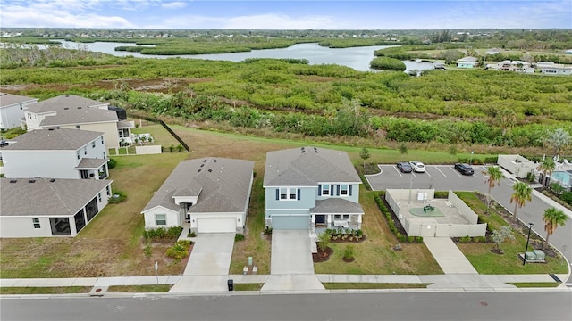 drone / aerial view featuring a water view