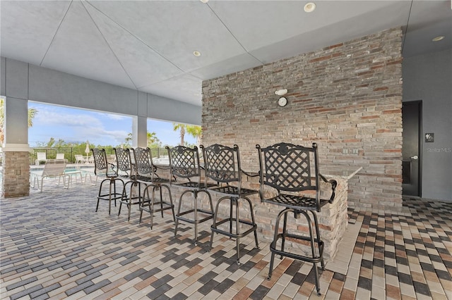 view of patio featuring a community pool and exterior bar