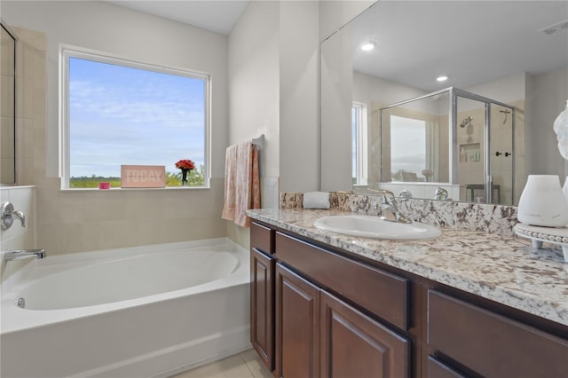 full bathroom with visible vents, a garden tub, tile patterned flooring, vanity, and a shower stall