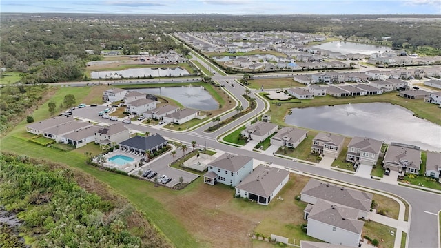 birds eye view of property with a residential view and a water view