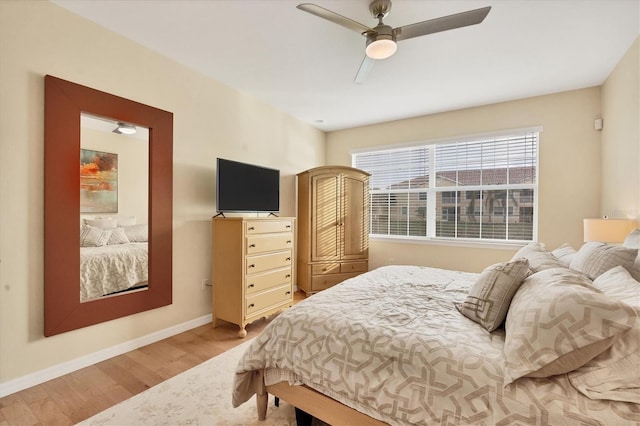 bedroom featuring ceiling fan and hardwood / wood-style flooring