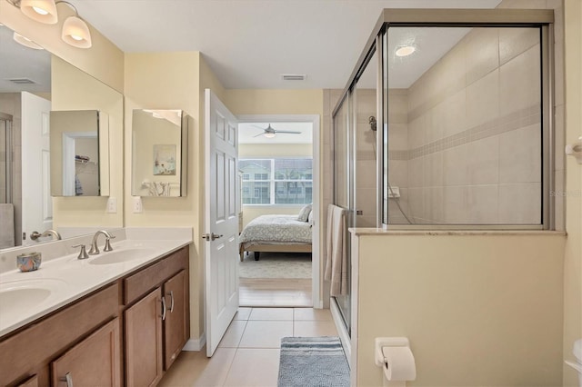 bathroom with vanity, tile patterned floors, walk in shower, and ceiling fan