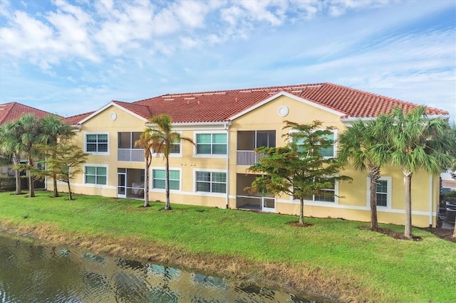 view of building exterior with a water view