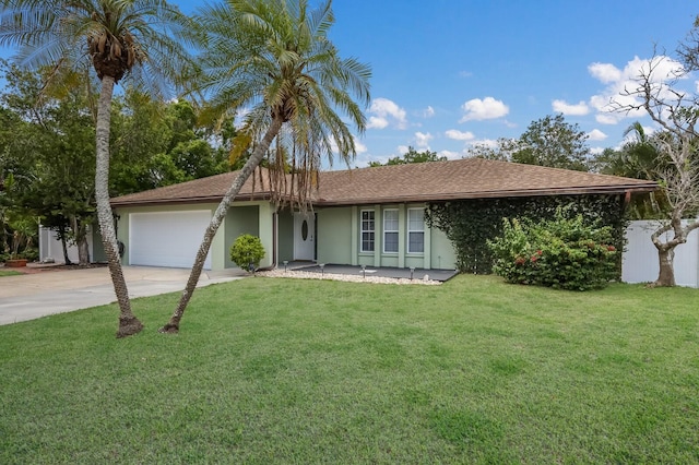 single story home featuring a front yard and a garage