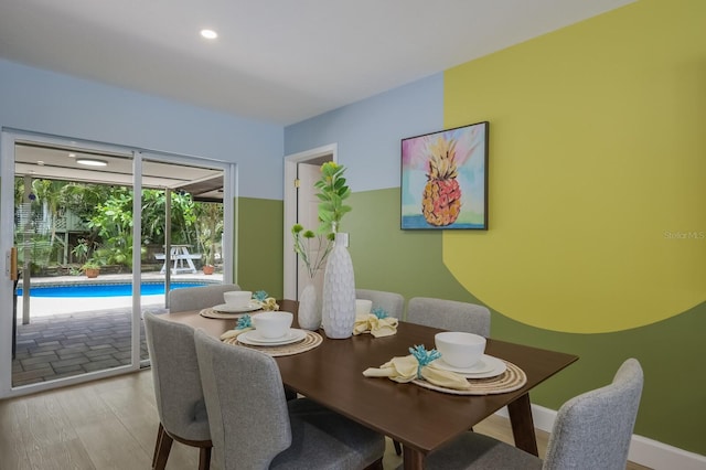 dining space featuring light hardwood / wood-style floors