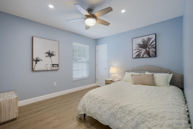 bedroom featuring hardwood / wood-style flooring and ceiling fan