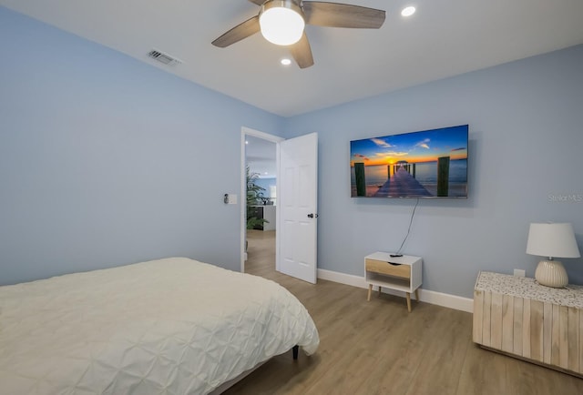 bedroom featuring wood-type flooring and ceiling fan