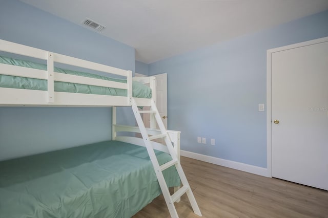 unfurnished bedroom featuring hardwood / wood-style flooring