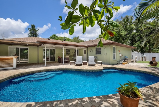 view of pool featuring a patio