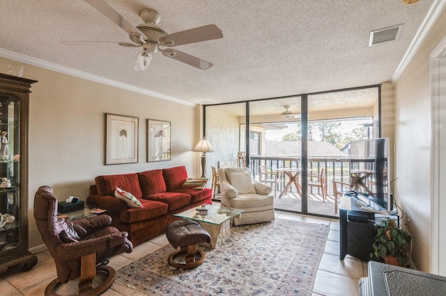 tiled living room with crown molding, expansive windows, and a textured ceiling