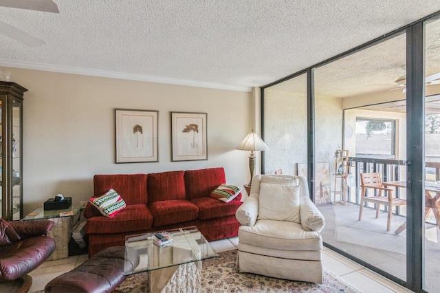 tiled living room featuring expansive windows, a textured ceiling, and ornamental molding