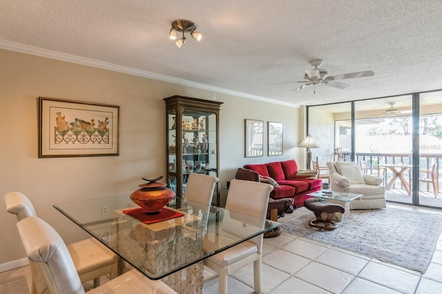 dining space with crown molding, ceiling fan, and a textured ceiling