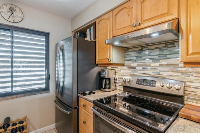 kitchen featuring decorative backsplash and appliances with stainless steel finishes