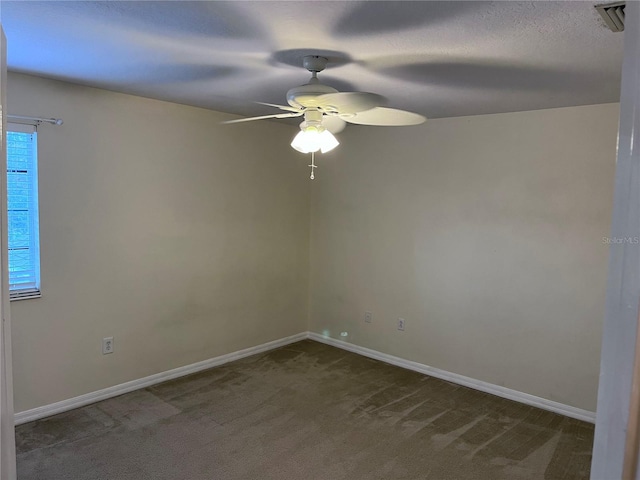 empty room with carpet floors and ceiling fan