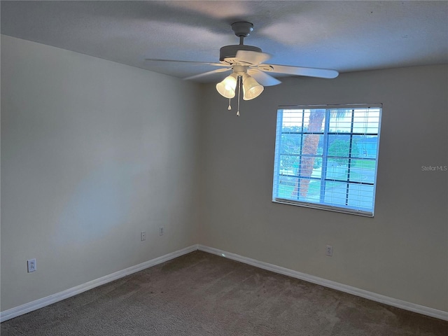 spare room with ceiling fan and carpet floors